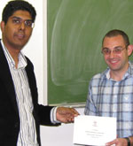 J.J. Troup (right) receiving the SAIMC prize from Vinesh Maharaj